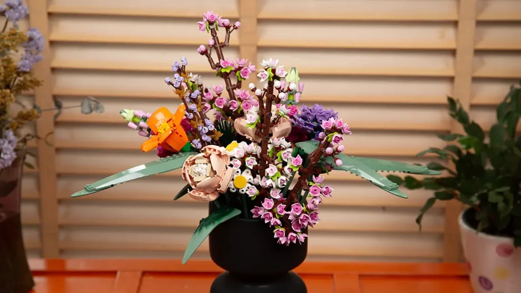 LEGO Flowers Cherry Blossoms and Flower Bouquet displayed in a vase near a window