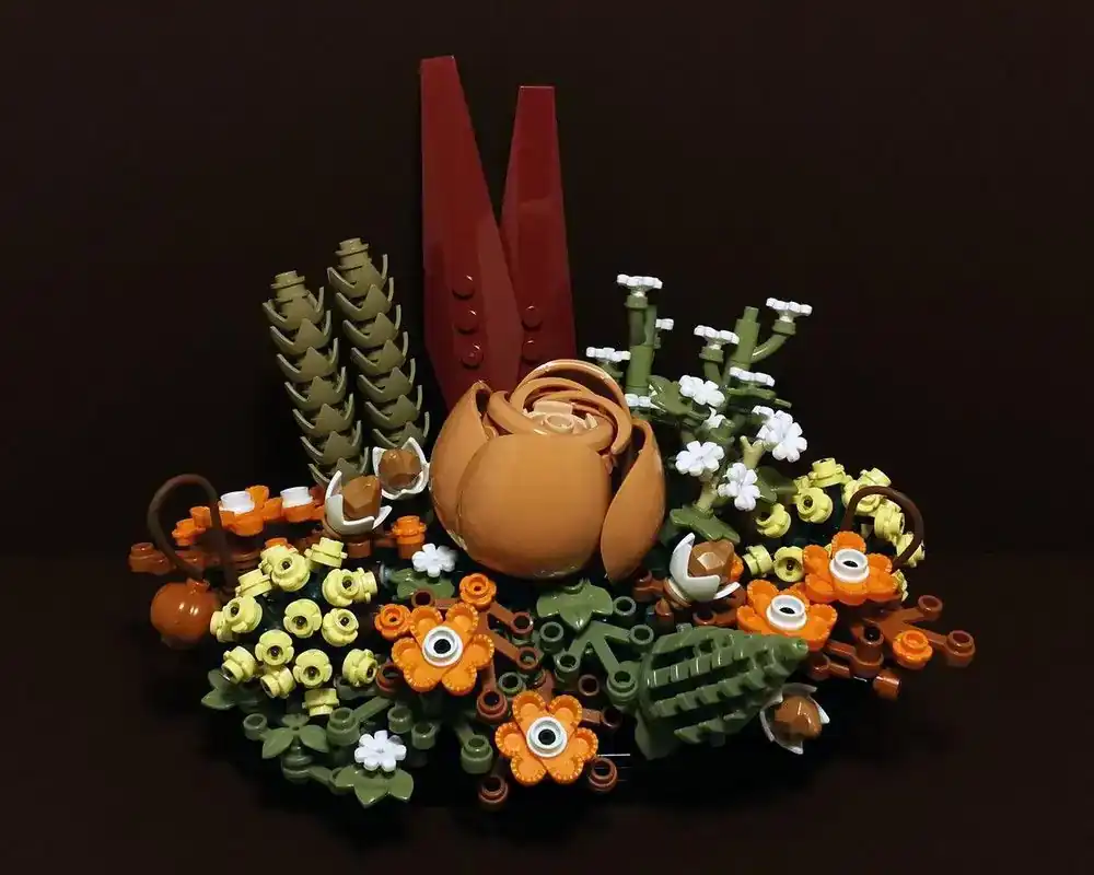 Custom LEGO autumn floral arrangement by Balage64 featuring tan, orange, yellow, and green elements on a dark background.