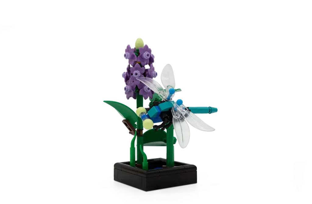 LEGO Botanicals Dragonfly Garden featuring a brick-built flowering stem and dragonfly on a black display base.