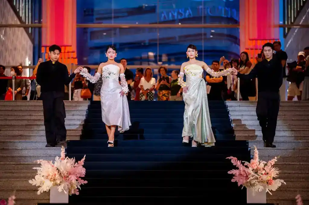 Models wearing LEGO Blooms on Silver Songket and Golden LEGO Florals on Heritage Songket designed by Fiziwoo for the MODA x LEGO Botanicals fashion showcase at Pavilion Kuala Lumpur.