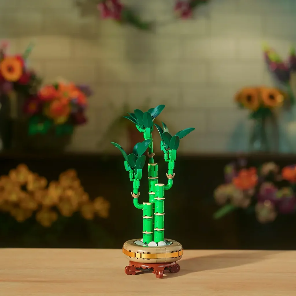 LEGO Botanicals lucky bamboo plant displayed in a small decorative pot with layered green stems.