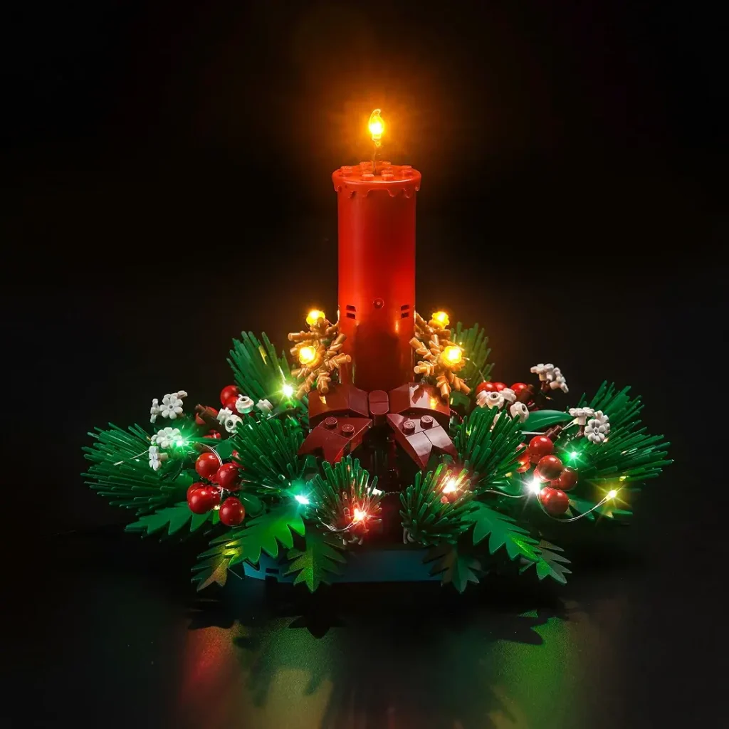 LEGO Christmas Table Decoration 40743 fully lit with BrickBling LEDs, featuring glowing candle, berries, greenery, and warm holiday lights.