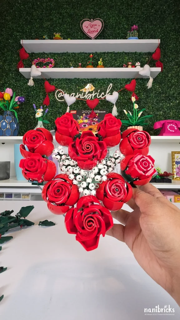 Heart-shaped vase filled with only LEGO roses arranged around the outer edge.