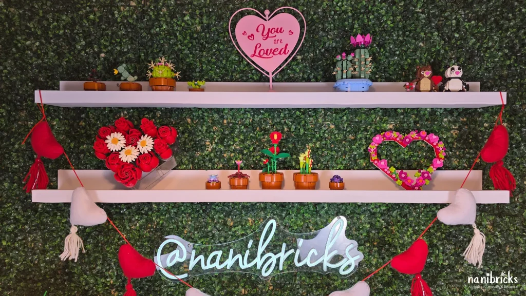 LEGO rose heart arrangement displayed on wall shelves alongside other LEGO Botanicals decor.