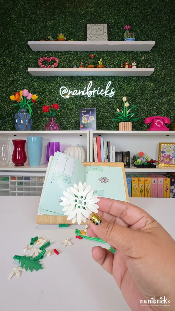 Close-up of large white daisy petals from LEGO Botanicals Daisies (11508) held in hand during build