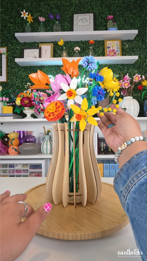 Adjusting LEGO flower arrangement for final balance and styling