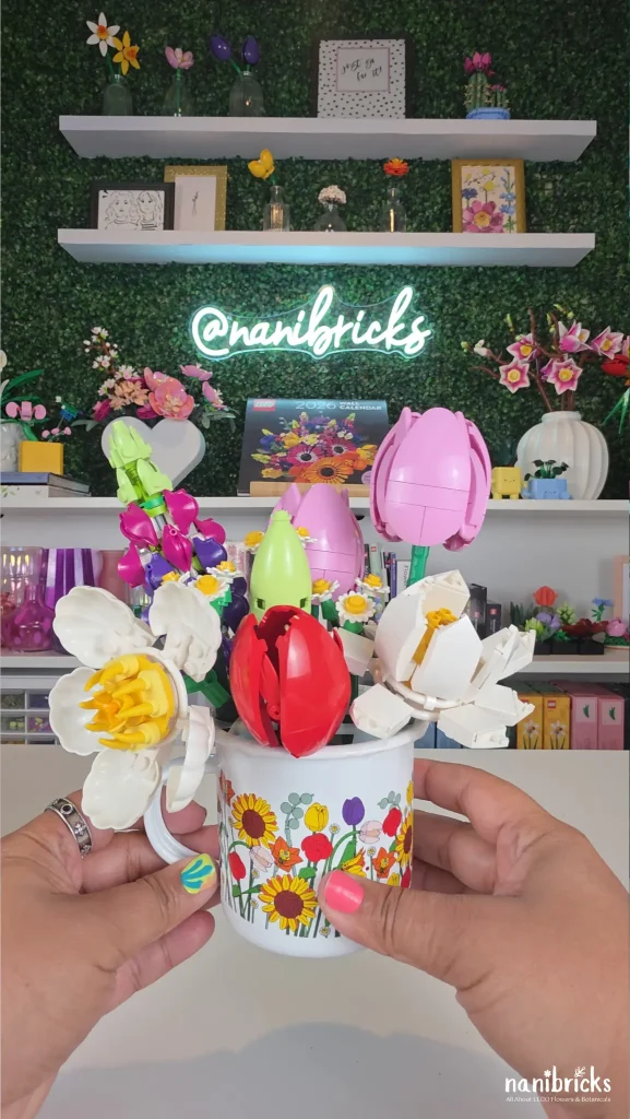 adjusting LEGO flower arrangement in mug for balance and depth