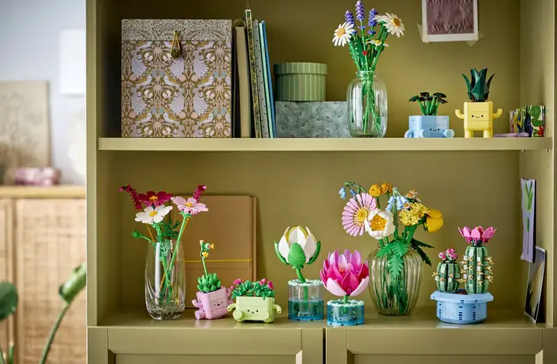 LEGO Botanicals display shelf featuring Water Lilies 11511 alongside other botanical sets